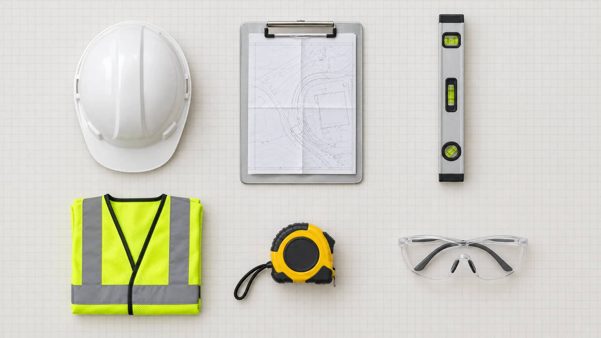 A civil engineer's site kit laid out on grid paper — hard hat, clipboard with a site plan, spirit level, hi-vis vest, tape measure and safety glasses — and the same six places holding a developer's kit: AirPods Pro, a MacBook Pro, a Keychron keyboard, a black t-shirt, an MX Master mouse and round glasses.